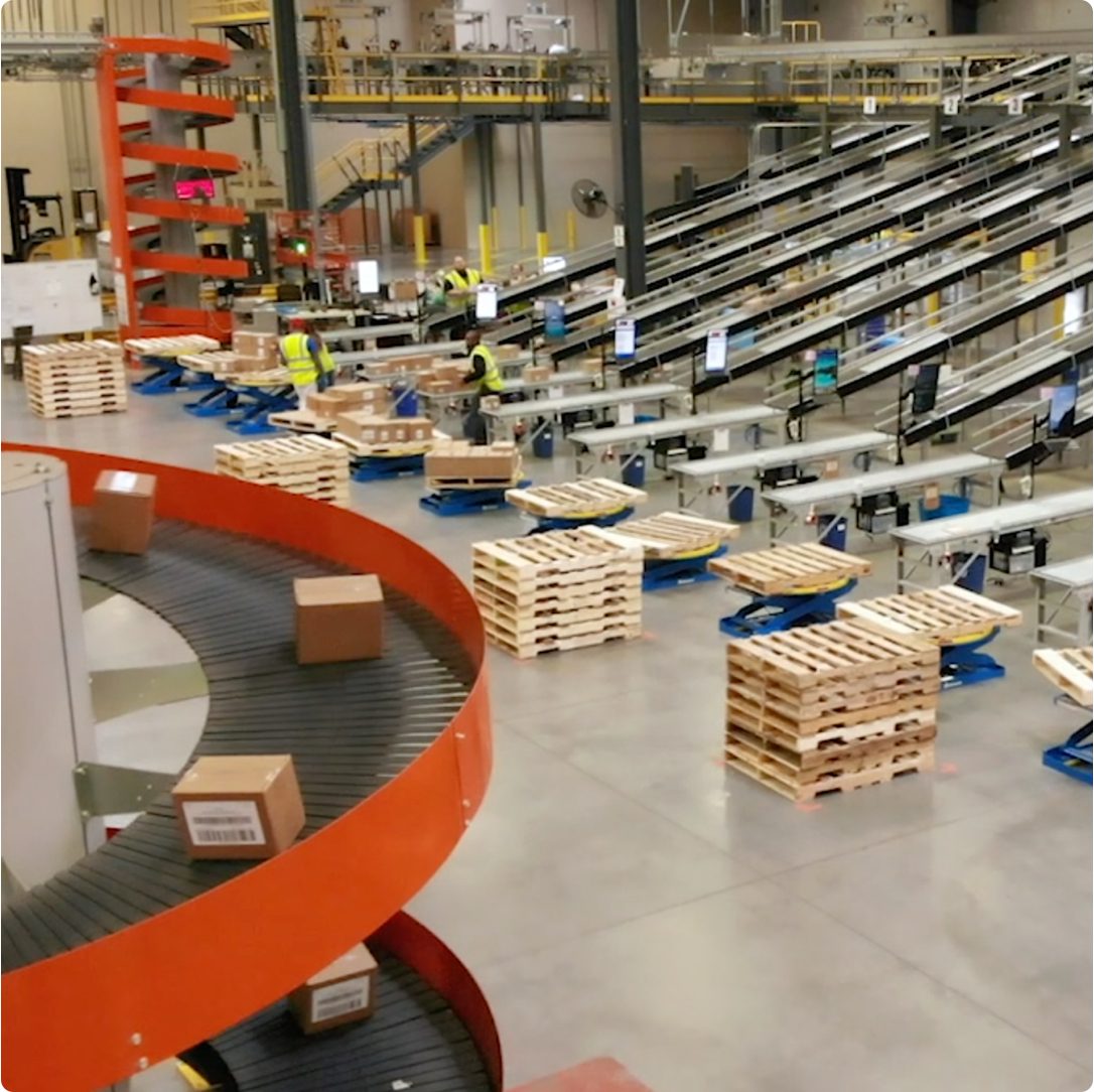 Warehouse facility with conveyers and pallet stacks